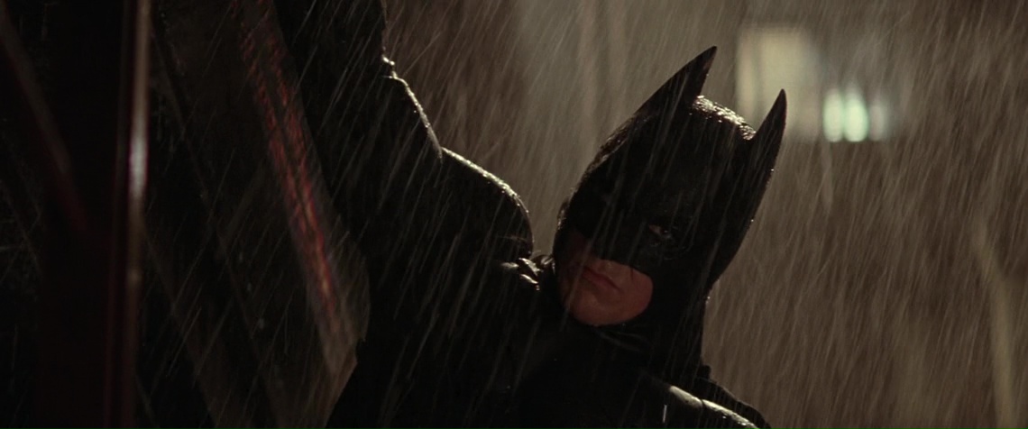 Batman is hanging somewhere in the rain